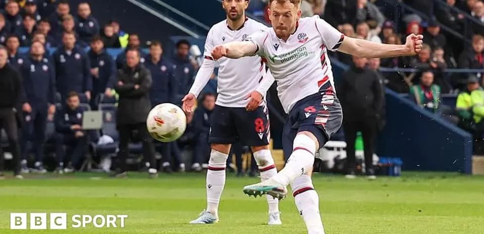 Bolton player taking a shot during the match
