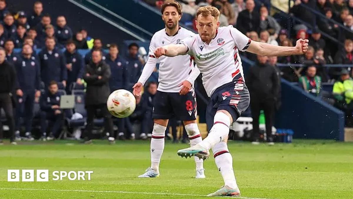 Bolton player taking a shot during the match