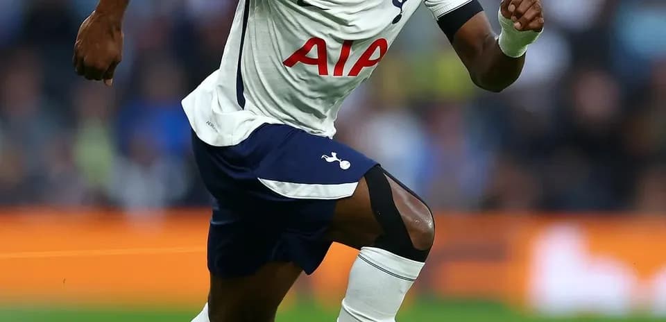 Player sprinting with ball on the pitch
