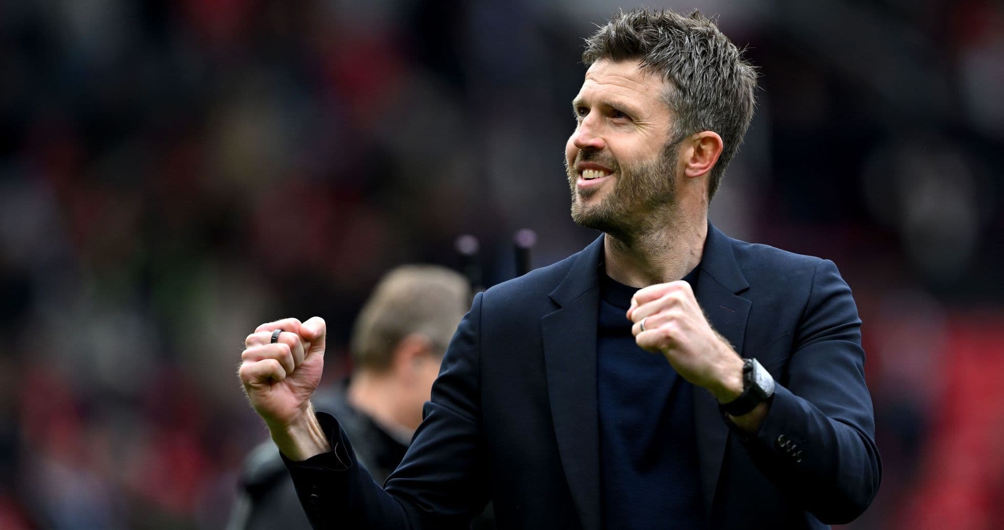 Manager celebrating with clenched fist on field