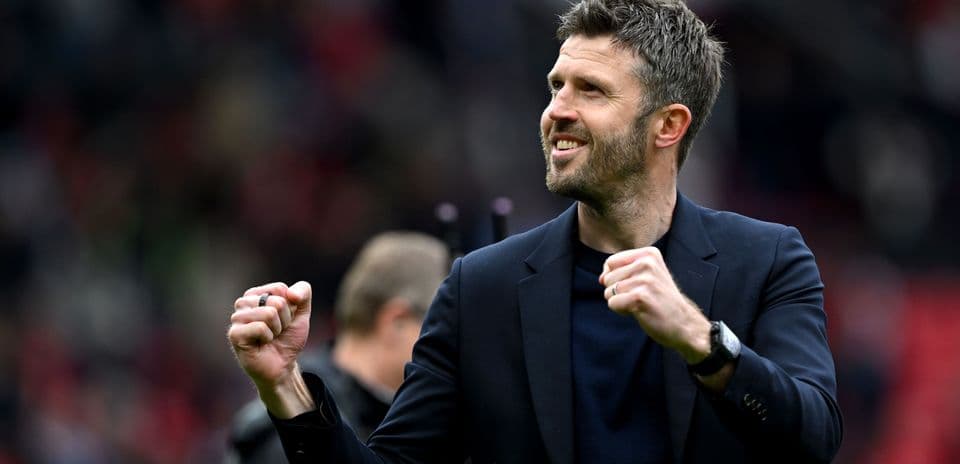 Manager celebrating with clenched fist on field