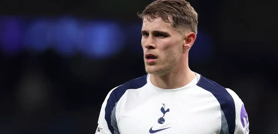 Player wearing Tottenham jersey on the field