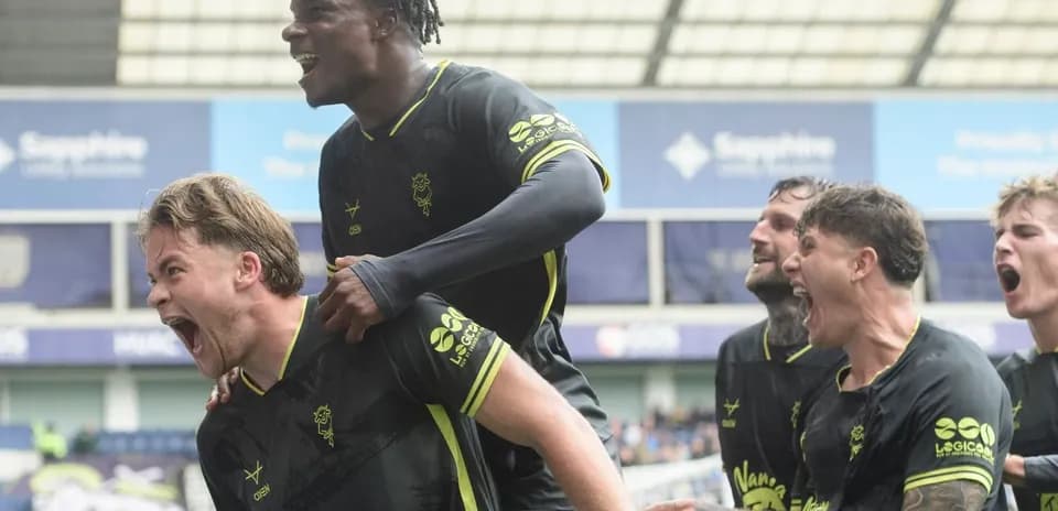 Players celebrating a goal during football match