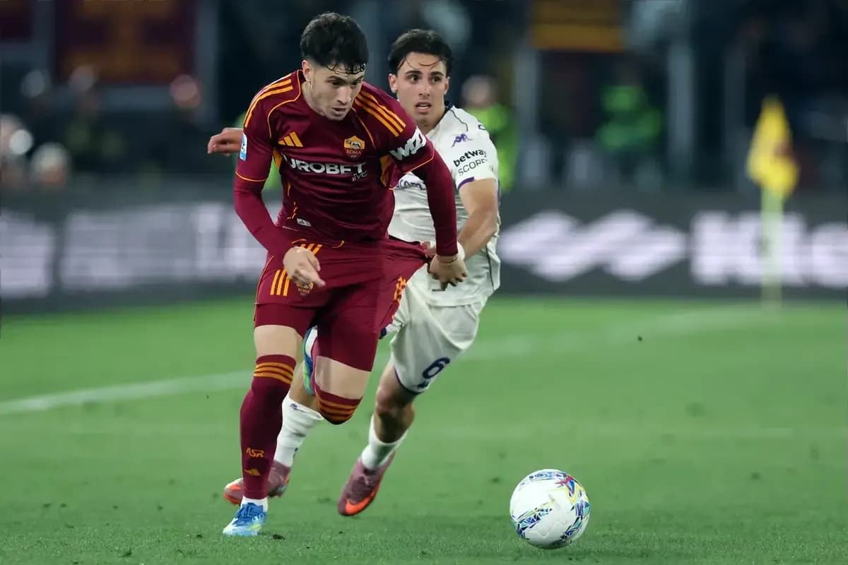 Player from AS Roma dribbling past opponent in match