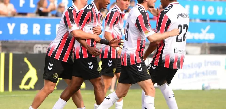 Players celebrating during Tampa Bay Rowdies match