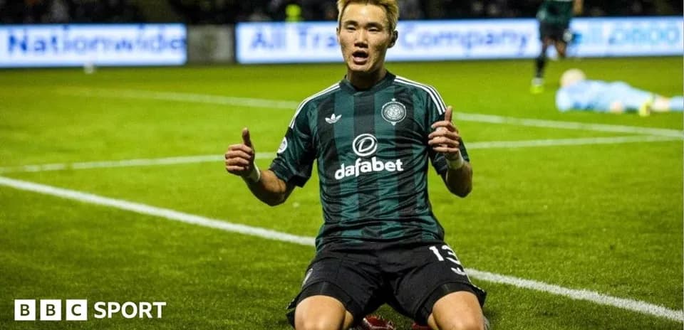 Player celebrating on the pitch after scoring