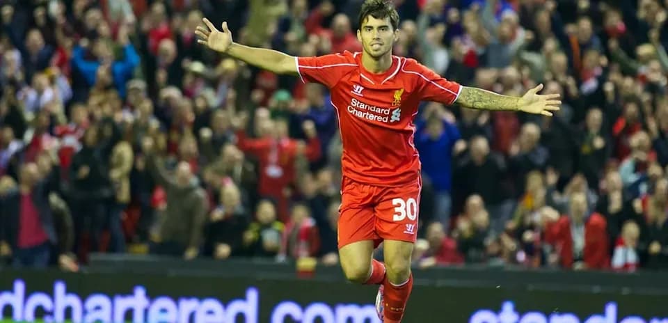 Liverpool player celebrating a goal in front of fans