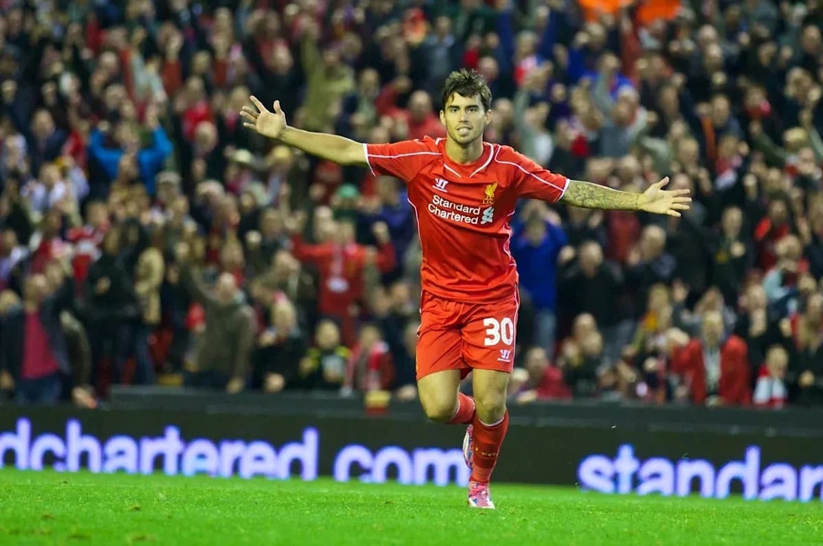 Liverpool player celebrating a goal in front of fans