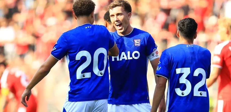 Three players celebrating during a match