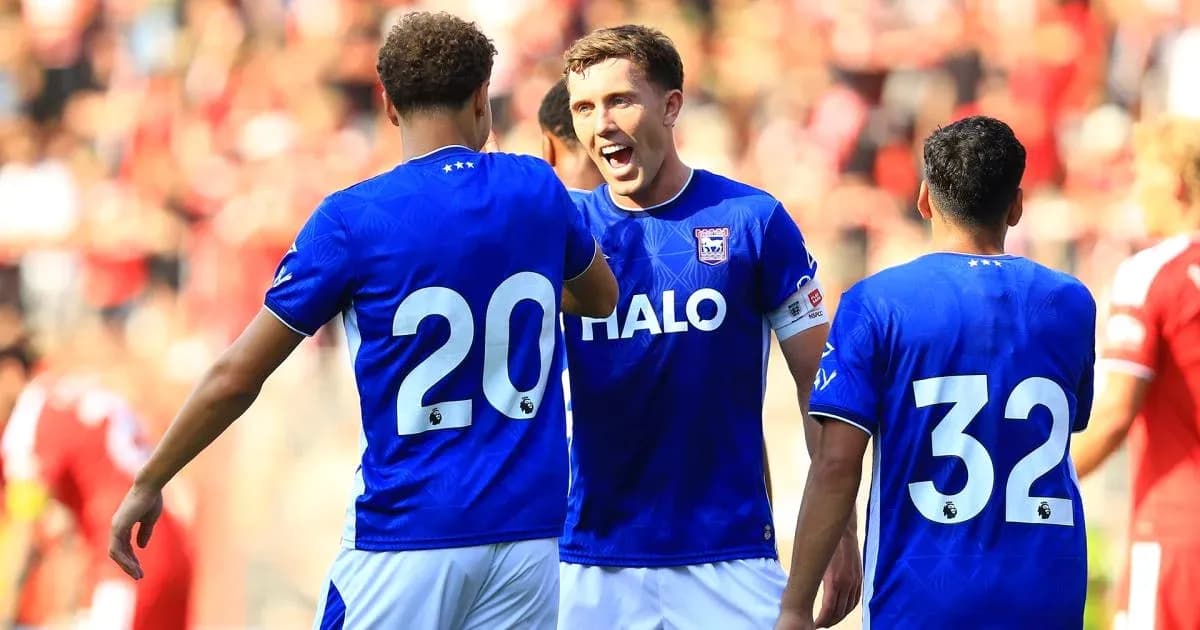 Three players celebrating during a match