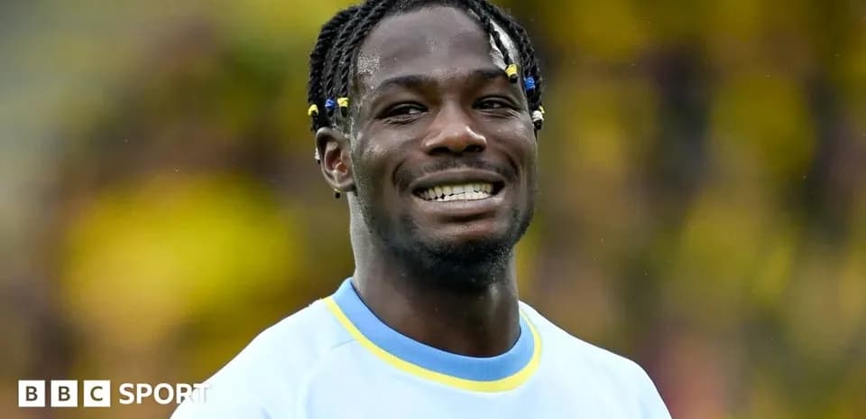 Player smiling during warm-up at stadium