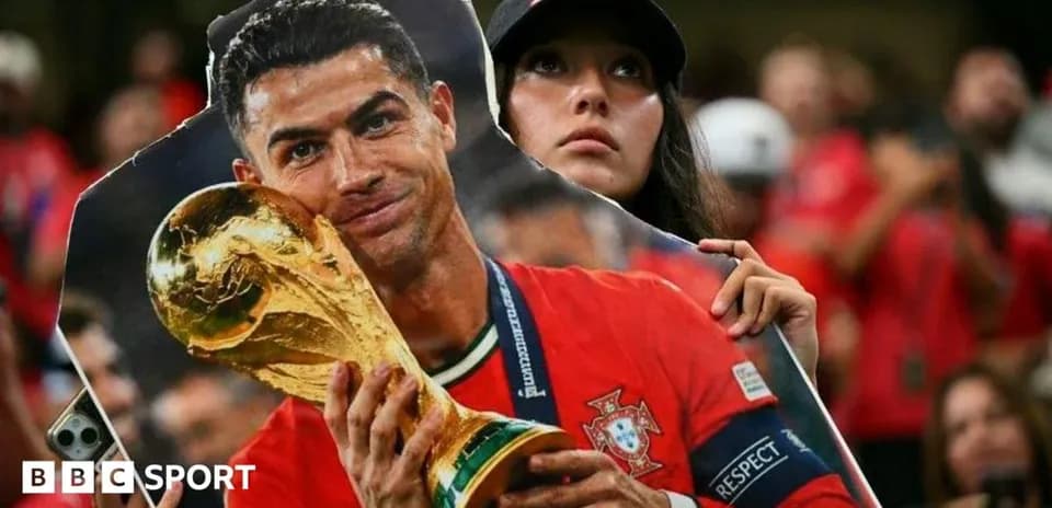 Fan holding a cutout of player with trophy