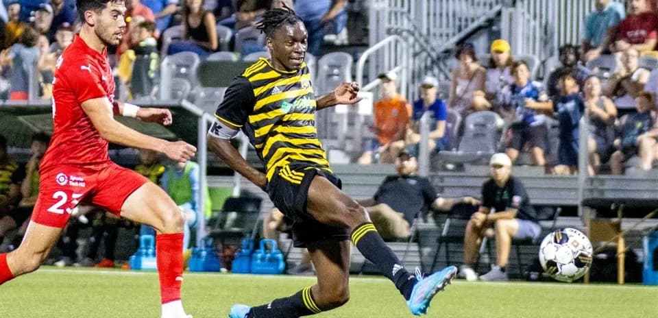 Pittsburgh Riverhounds player kicking the ball