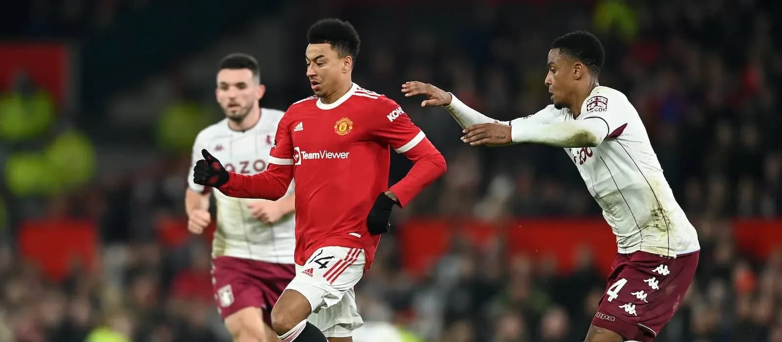 Manchester United player running with ball during match
