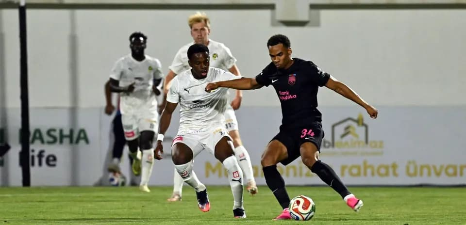 Player dribbling during KuPS vs Sabah FA match