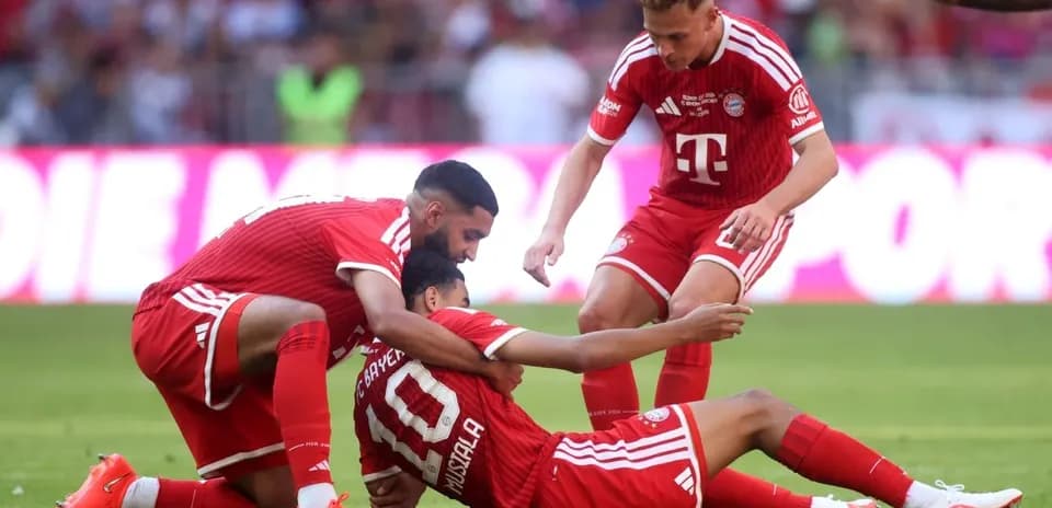 Bayern Munich players celebrating with Jamal Musiala