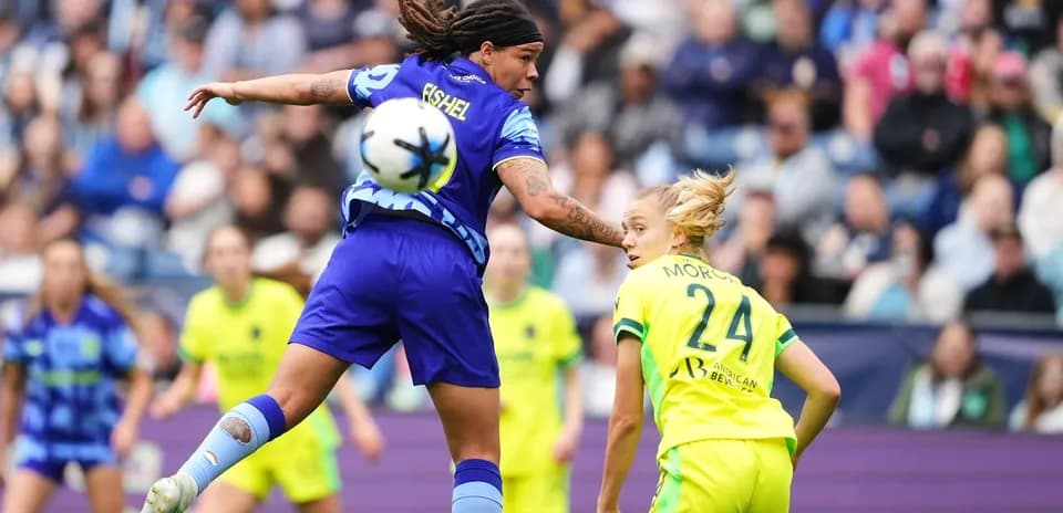 Player challenging for the ball during match