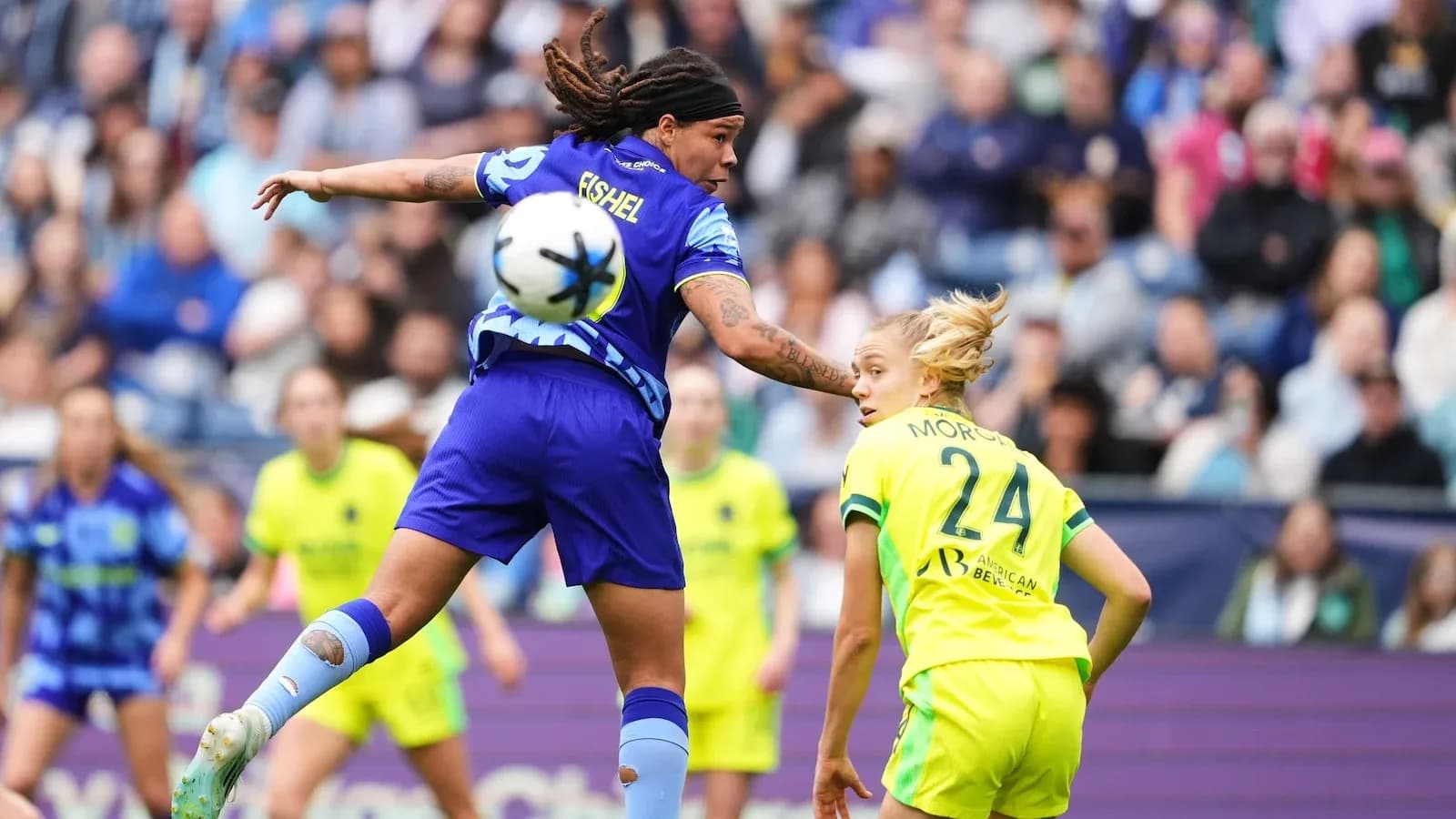 Player challenging for the ball during match