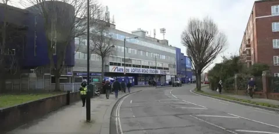 Exterior view of Loftus Road Stadium on a street