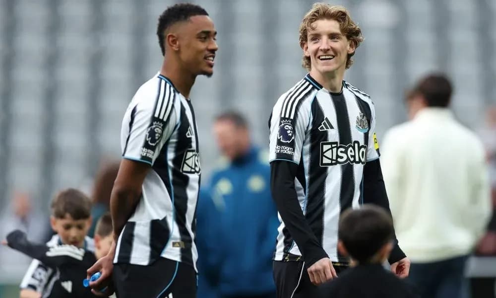Two Newcastle players smiling during training session