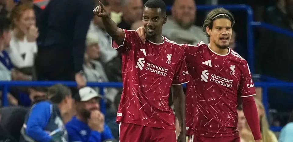 Two Liverpool players celebrating during a match