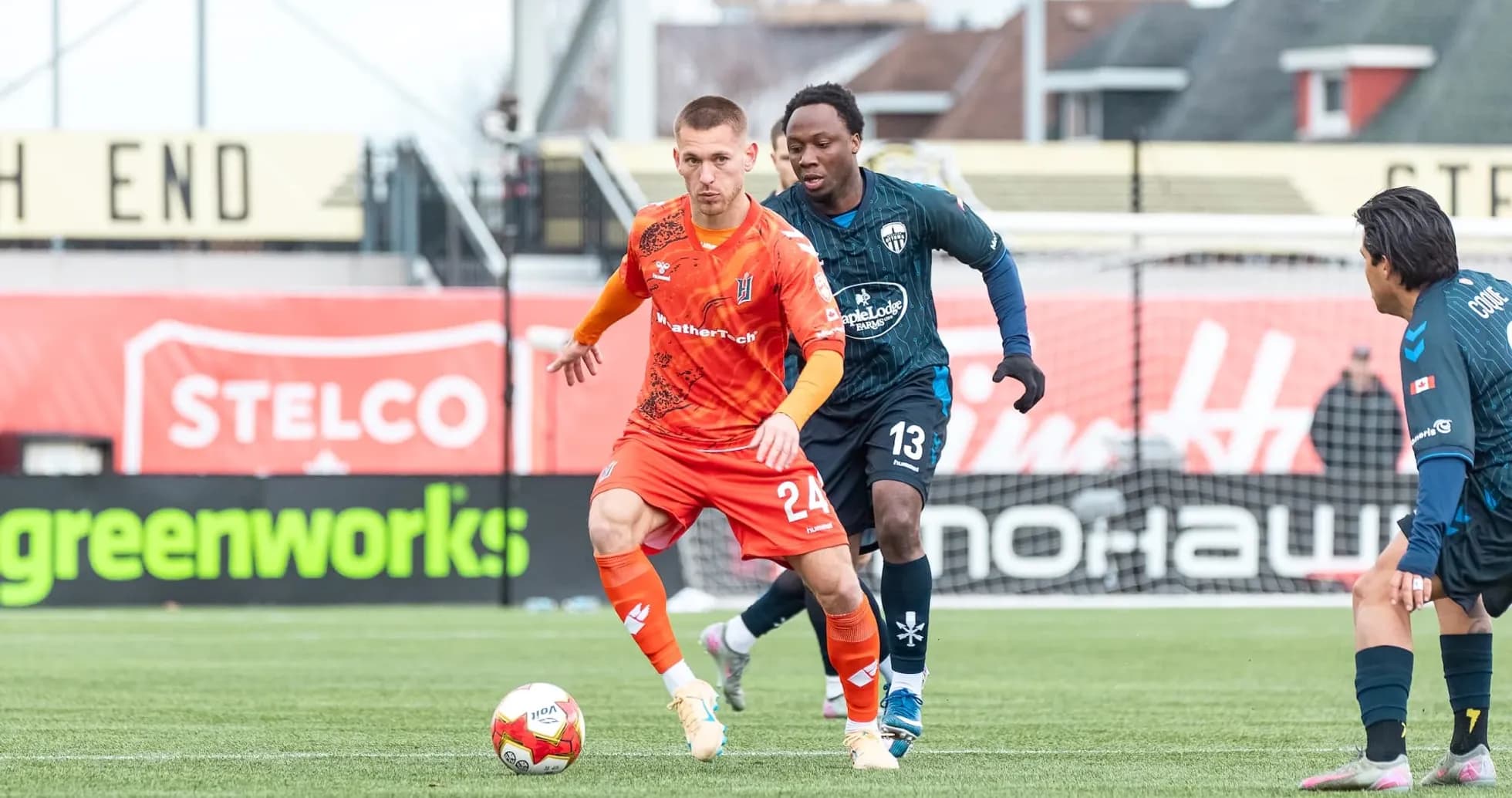 Player dribbling the ball during Forge match