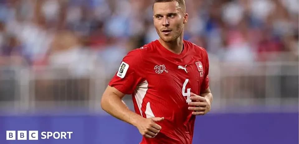 Player wearing red Switzerland jersey during match