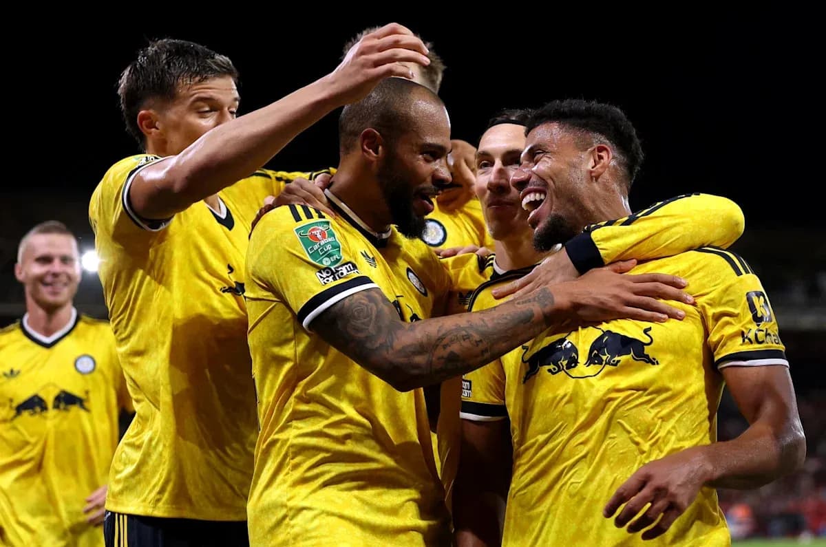 Players celebrating a goal during a match