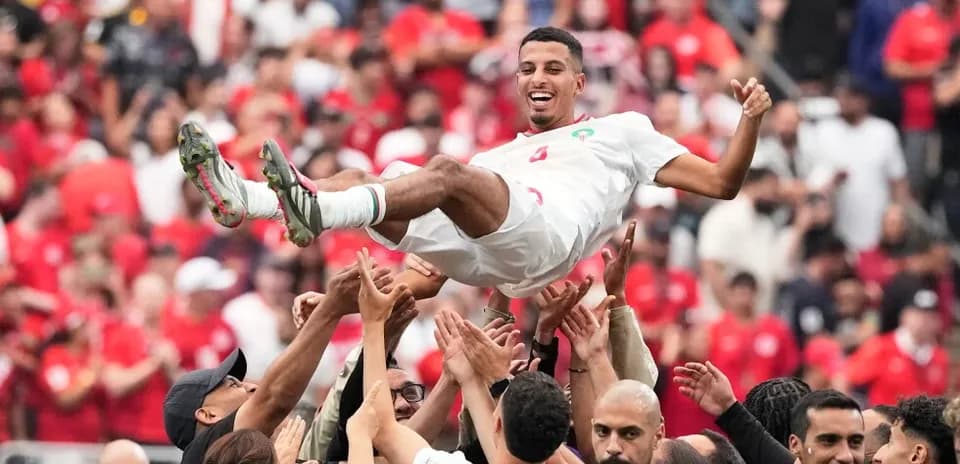 Player celebrating with fans after match victory