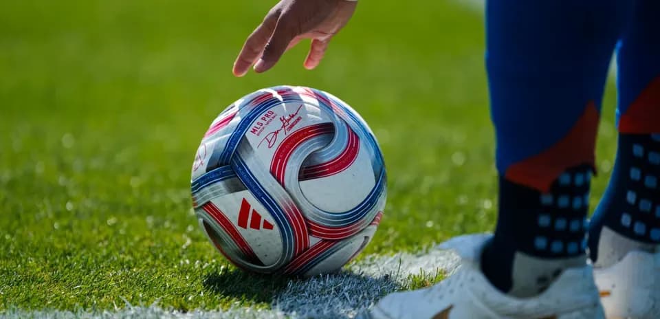 Player preparing to kick soccer ball