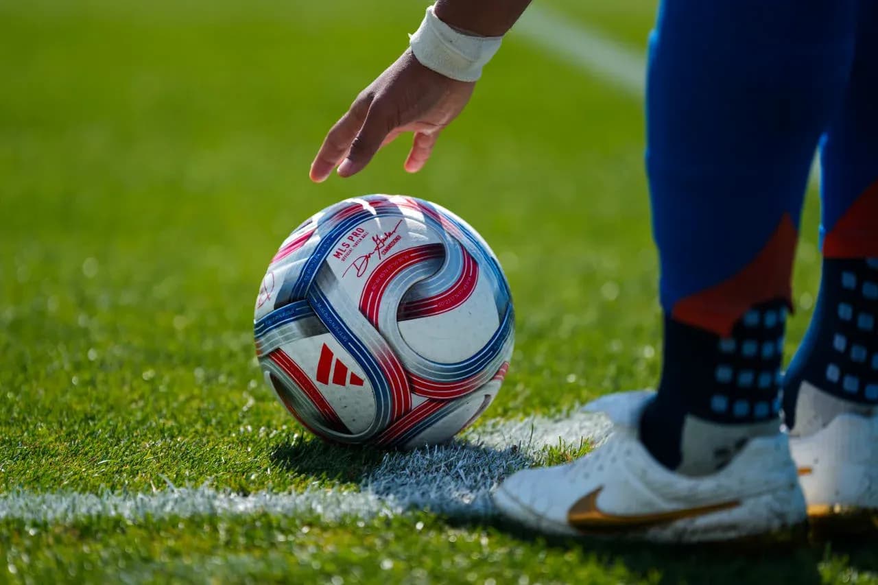 Player preparing to kick soccer ball