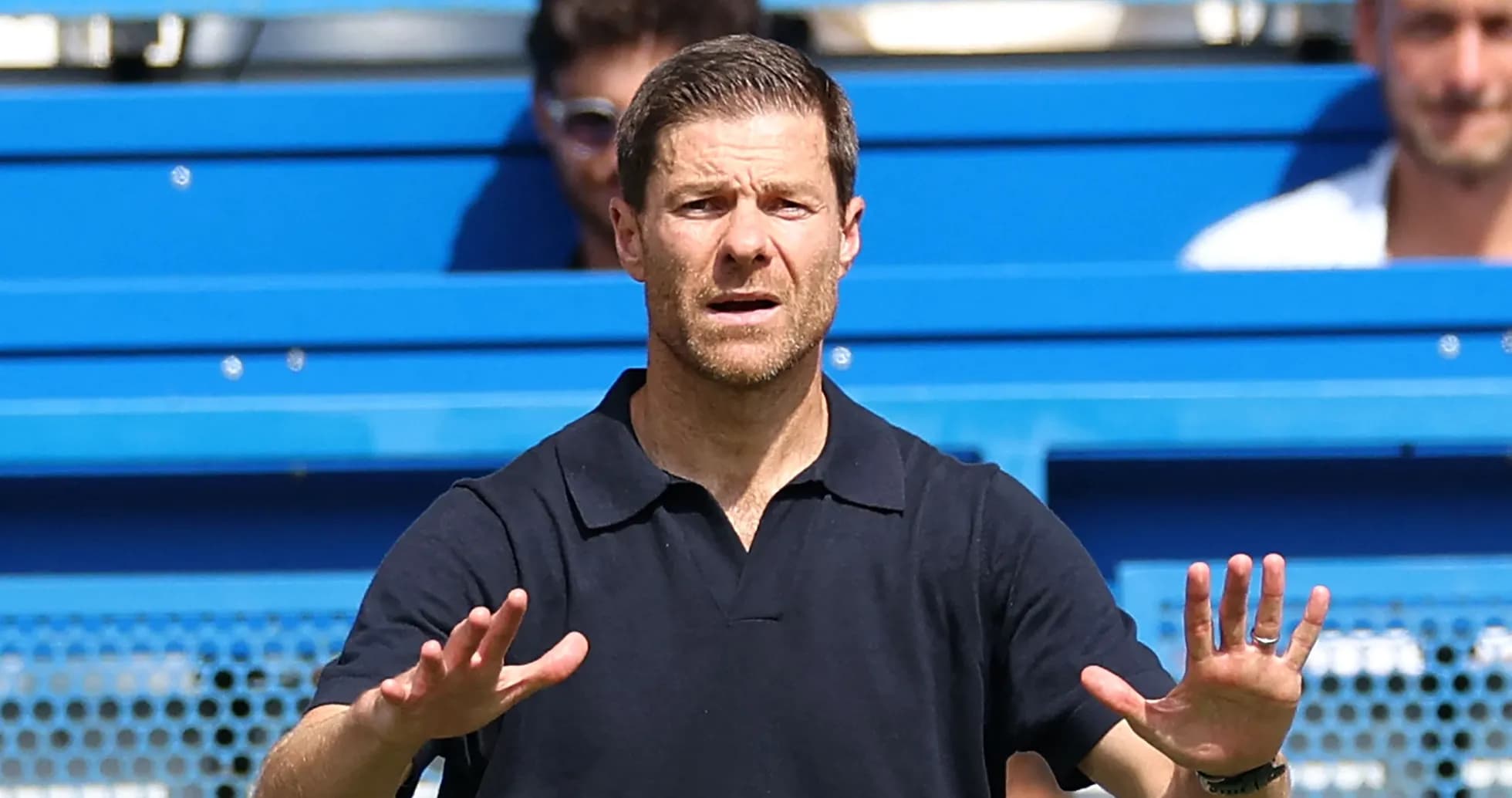 Coach gesturing during a match on the sidelines