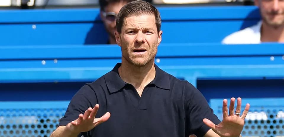 Coach gesturing during a match on the sidelines