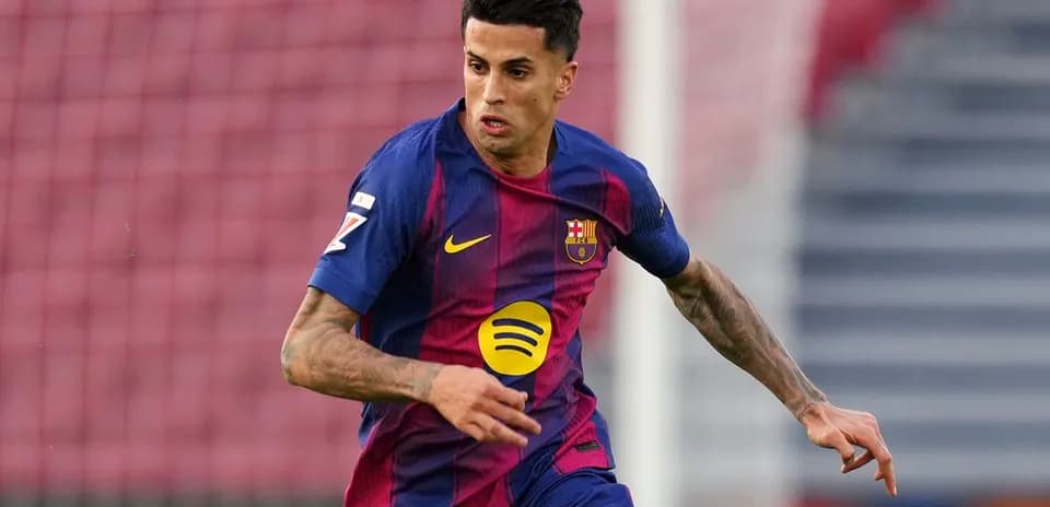 Player in Barcelona jersey running on the pitch