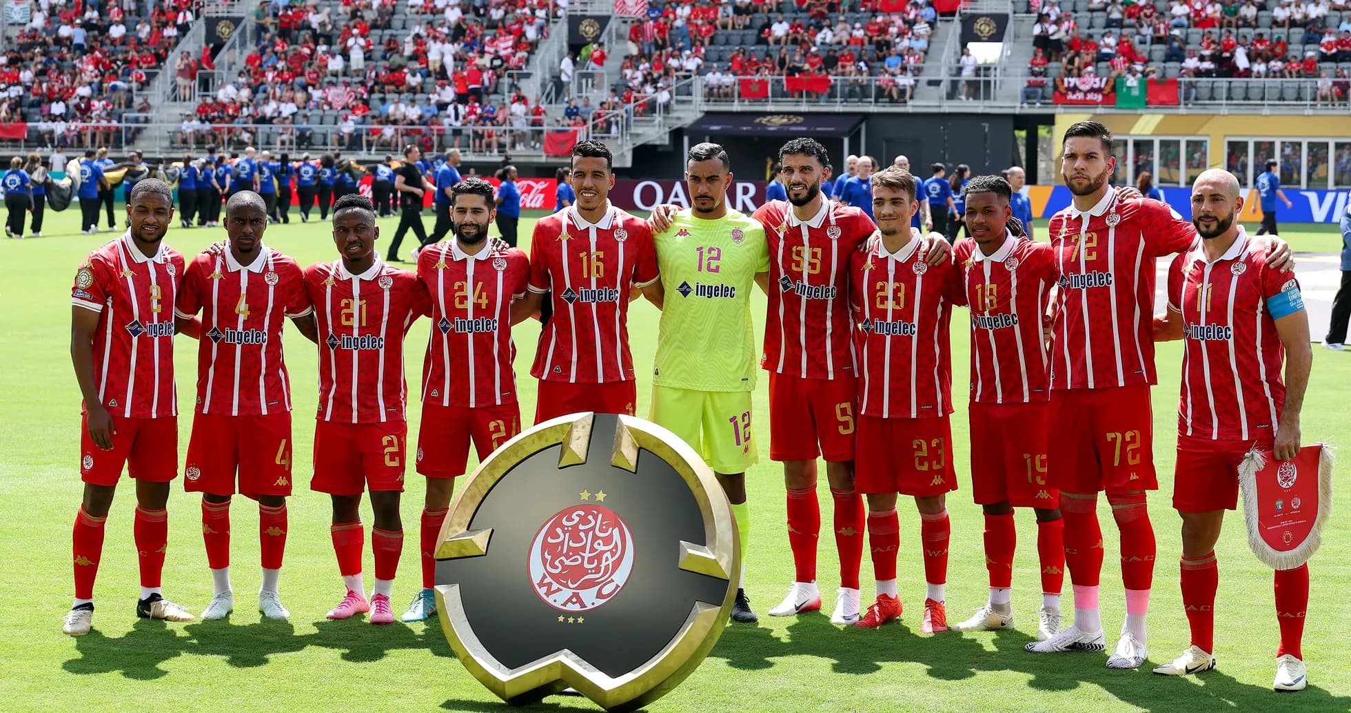 Wydad Casablanca players posing with trophy before match