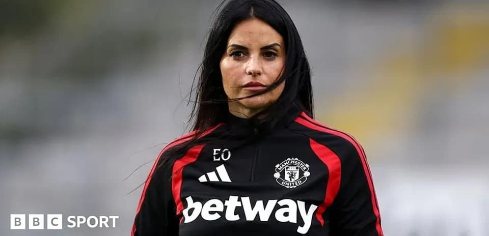 Female coach in Manchester United training gear