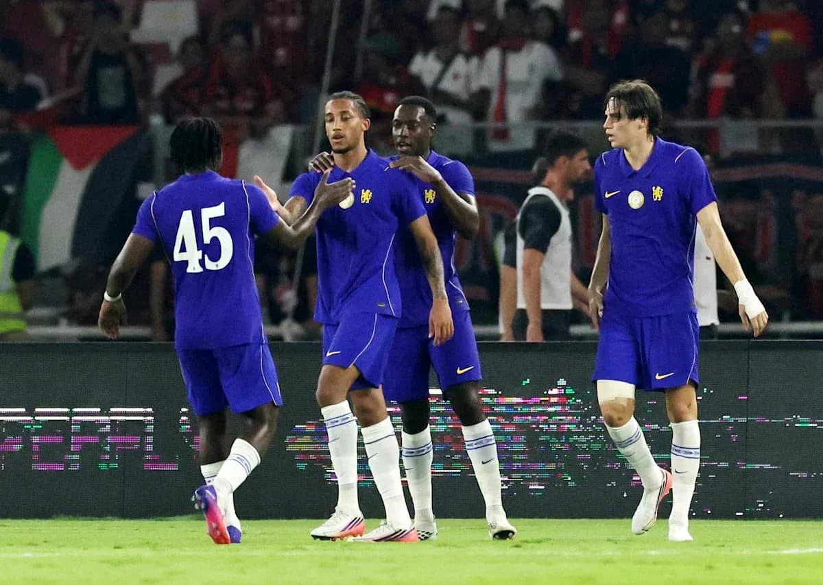 Players celebrating a goal during a football match