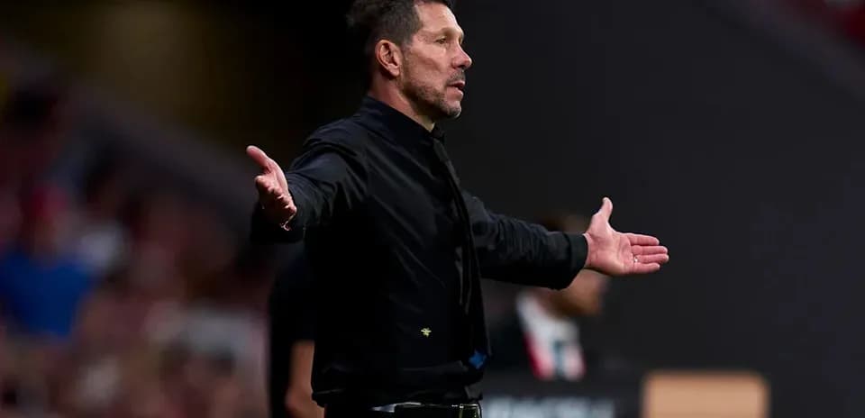 Coach gesturing during a match on the sideline