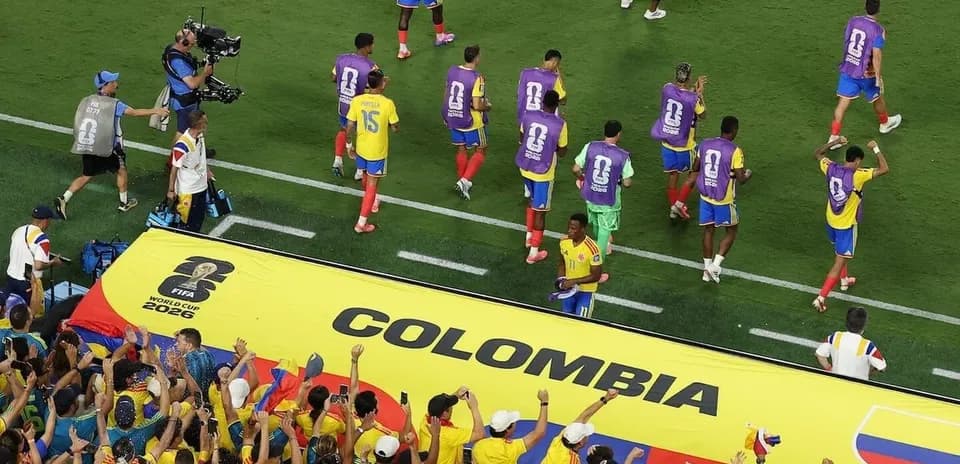 Colombian players celebrating with fans during match