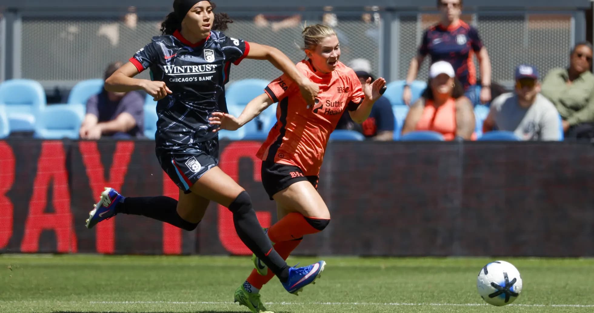 Bay FC player competing for the ball against Chicago Red Stars