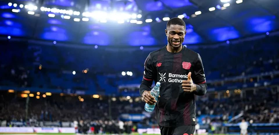 Player celebrating with water bottle on the pitch