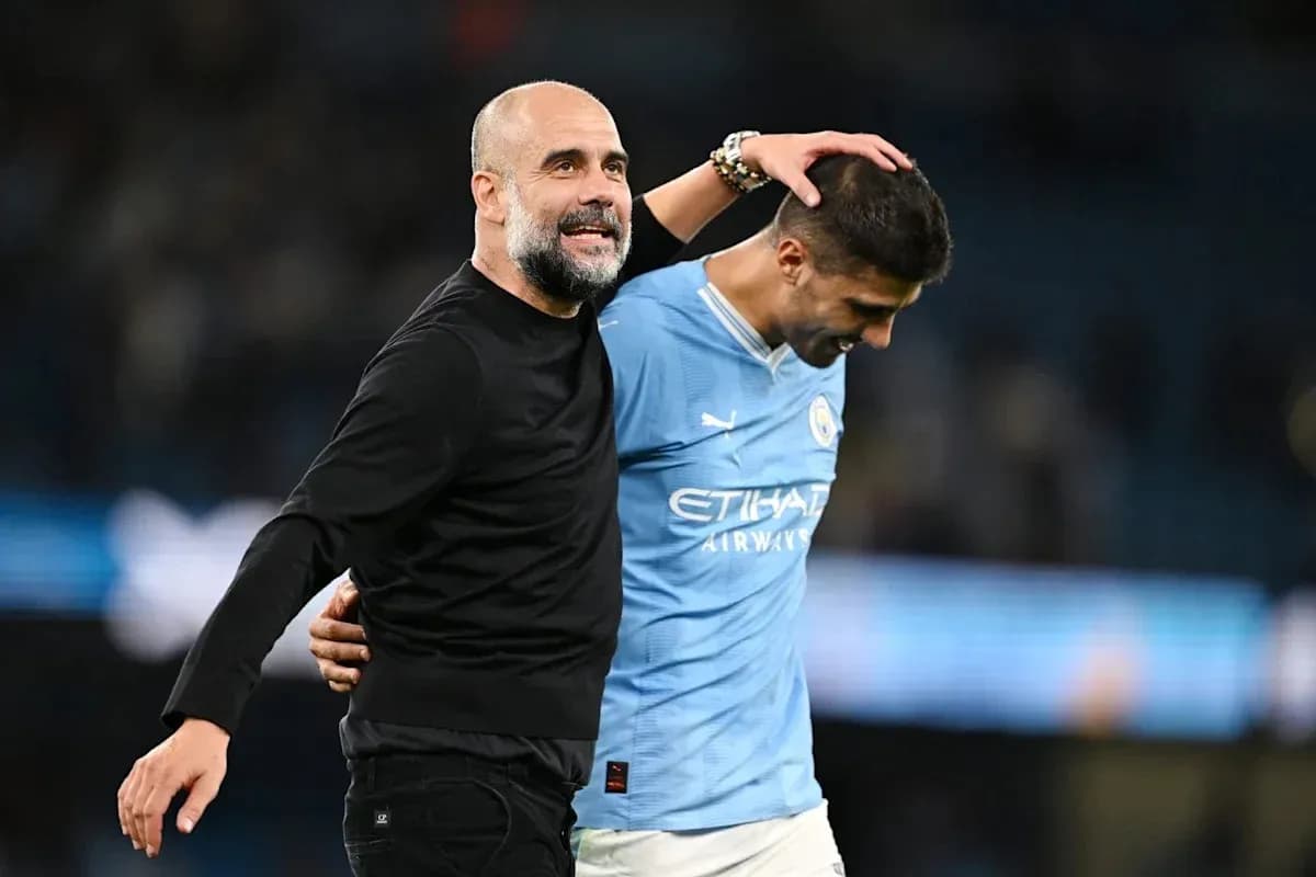 Manager and player celebrating after match conclusion
