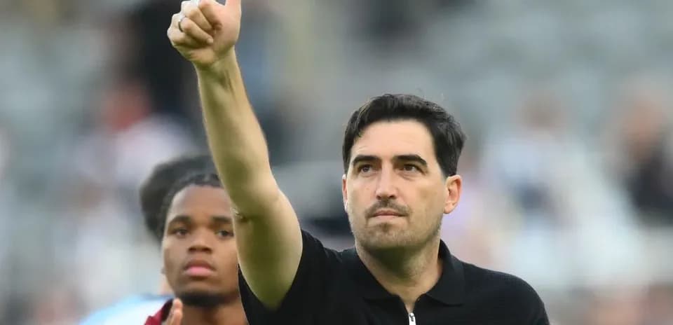 Coach giving thumbs up after the match