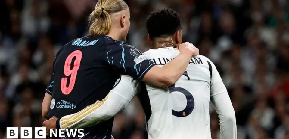 Two players embracing during a football match
