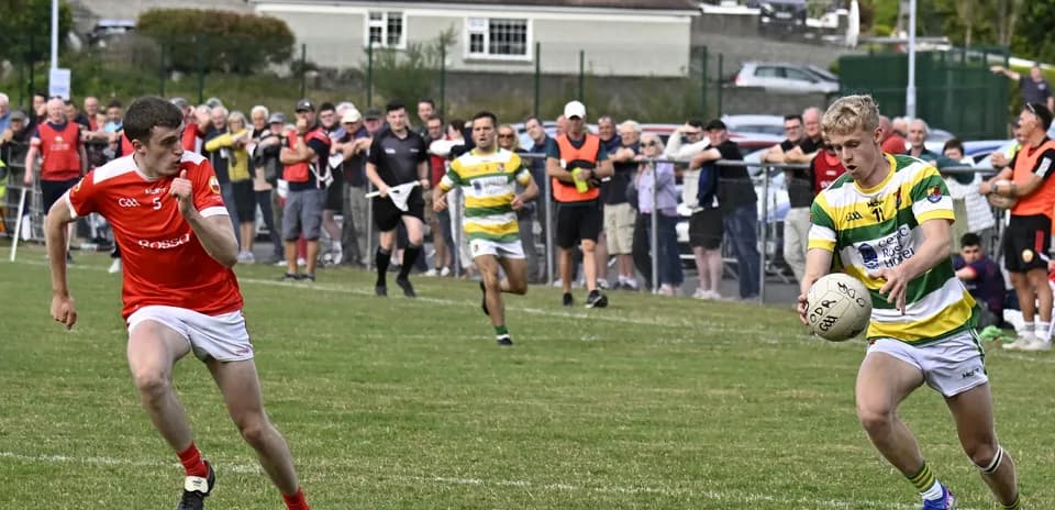Two players competing for the ball in match