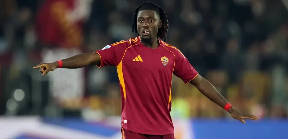 Player gesturing during match in Roma kit