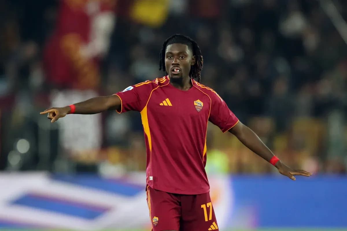 Player gesturing during match in Roma kit