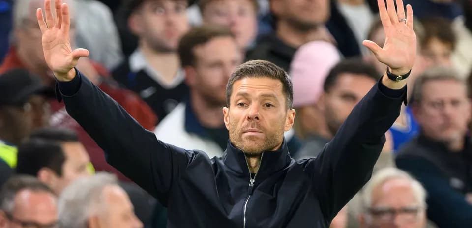 Coach signaling instructions to players during match