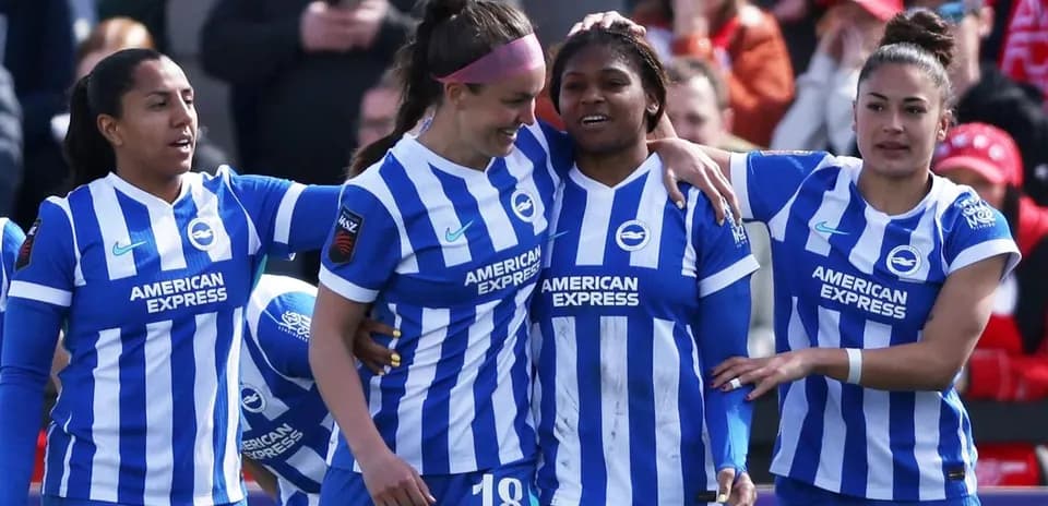 Brighton W players celebrating a goal