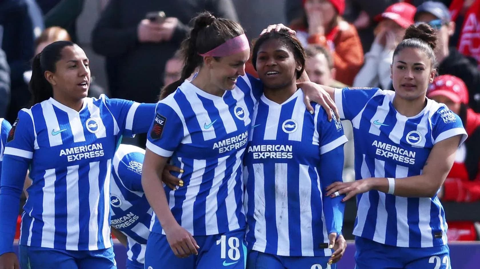 Brighton W players celebrating a goal